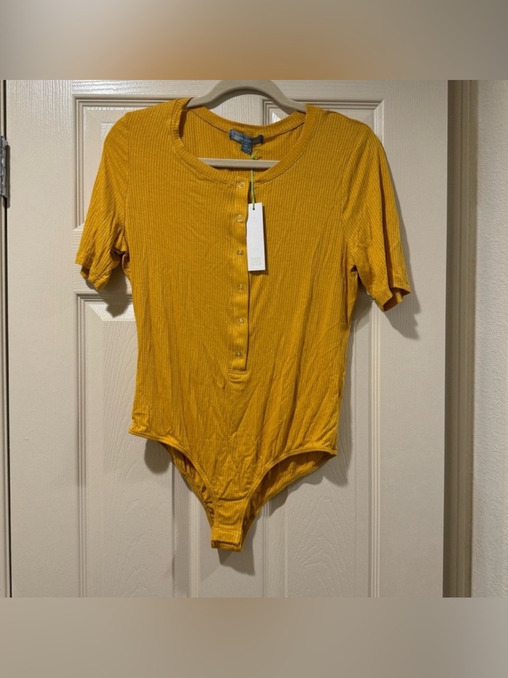 Good Luck Gem Women’s Size S Yellow Ribbed Short Sleeve Bodysuit NWT